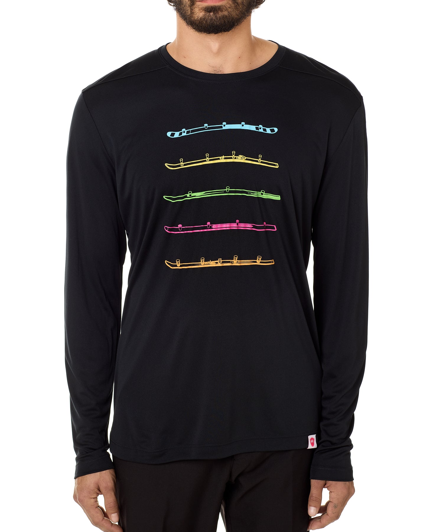 A male model wearing a long sleeve black shirt with bold colorful shot ski graphics.