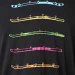 Detail view of the black Shot Ski performance long sleeve on a white background, featuring five multicolored shot skis illustrated in a line art style across the front.
