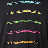Detail view of the black Shot Ski performance long sleeve on a white background, featuring five multicolored shot skis illustrated in a line art style across the front.