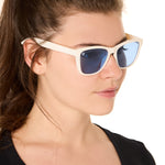 front view of a female model wearing the coastal cloud sunglasses on a white background