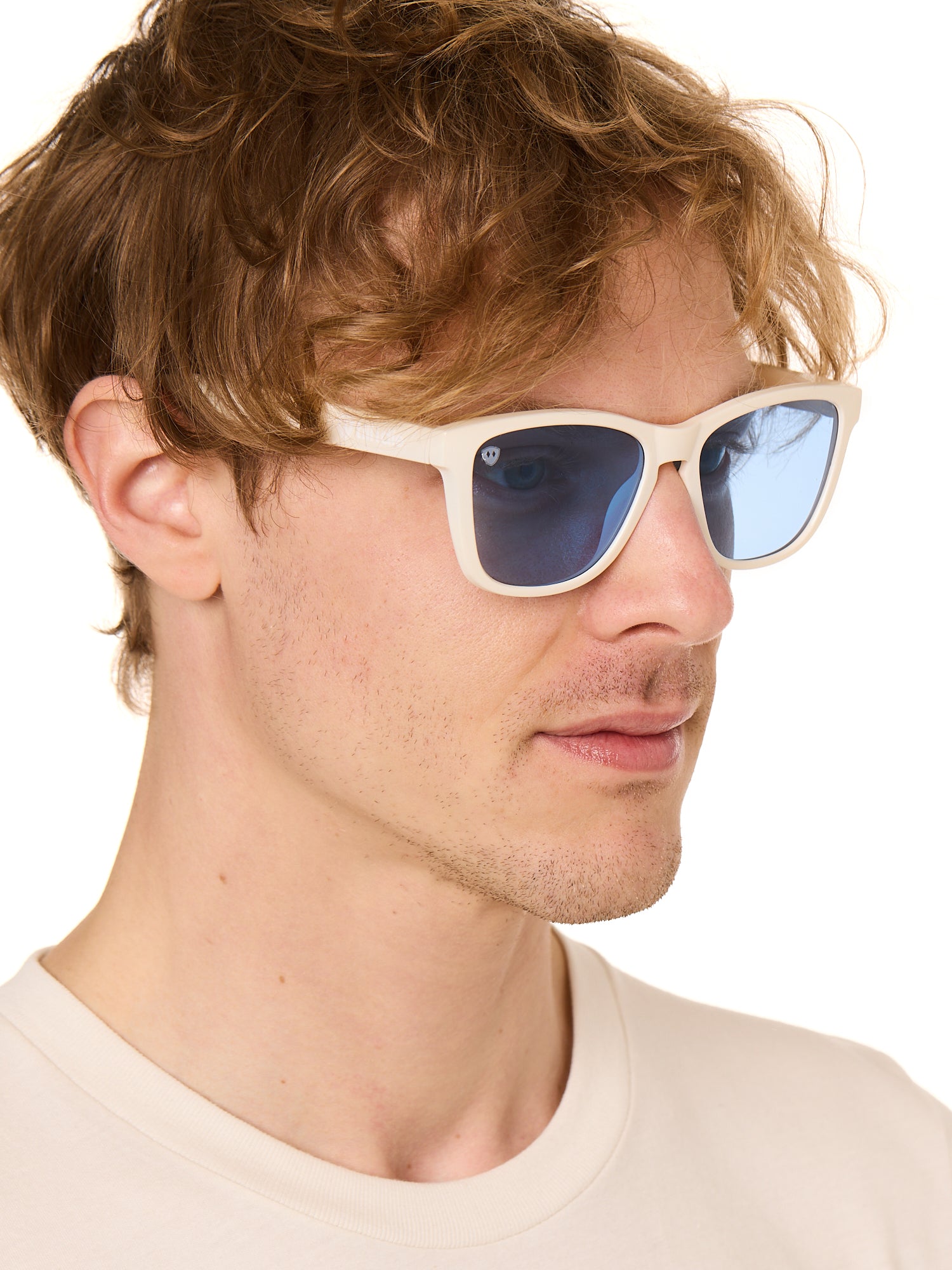front view of a male model wearing the coastal cloud sunglasses on a white background