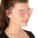 front view of a female model wearing the rosé ripple sunglasses on a white background
