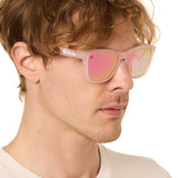 front view of a male model wearing the rosé ripple sunglasses on a white background