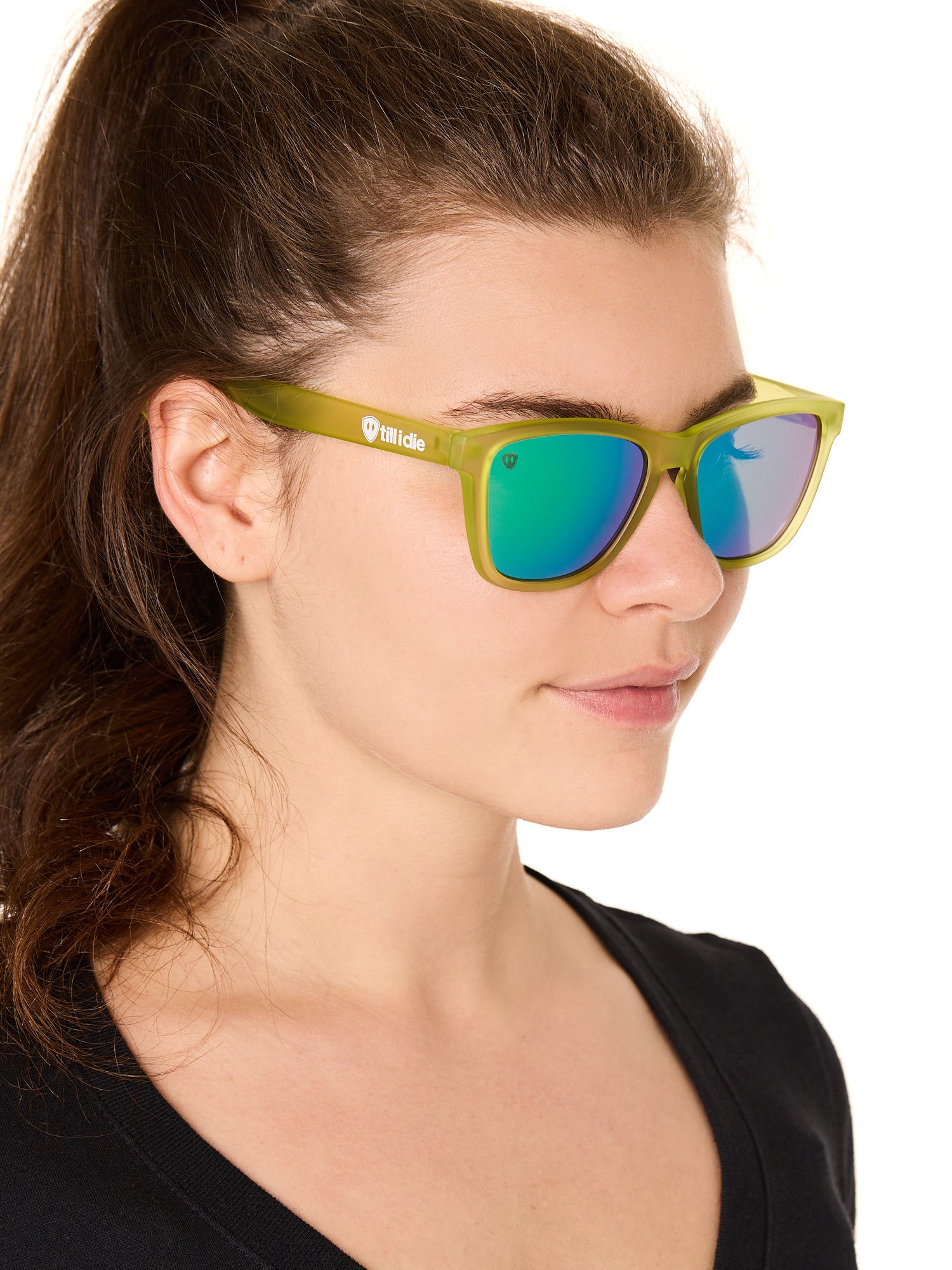 front view of a female model wearing the electric jungle sunglasses on a white background