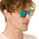 front view of a male model wearing the electric jungle sunglasses on a white background