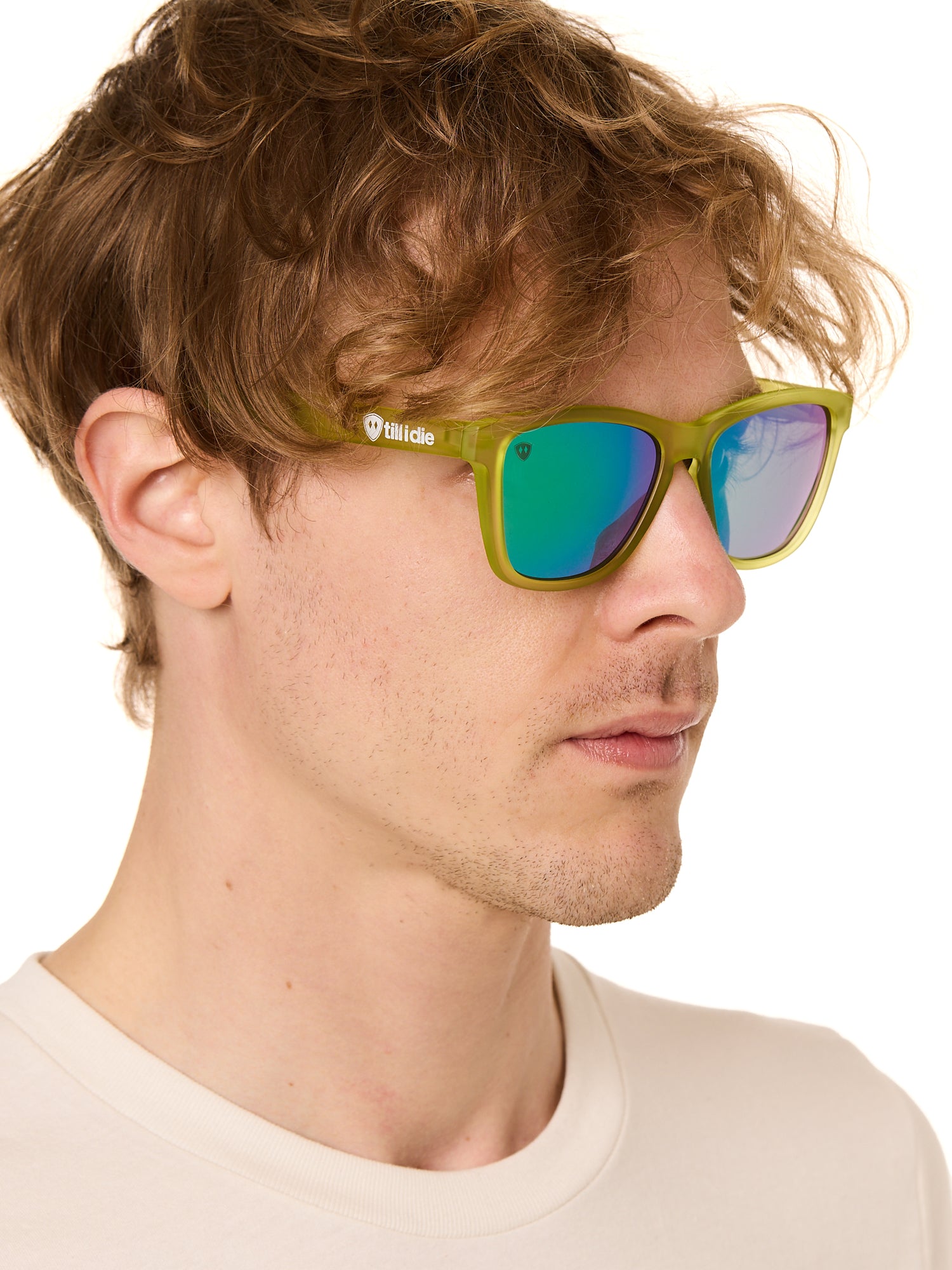 front view of a male model wearing the electric jungle sunglasses on a white background