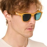 front view of a male model wearing the mango mermaid sunglasses on a white background