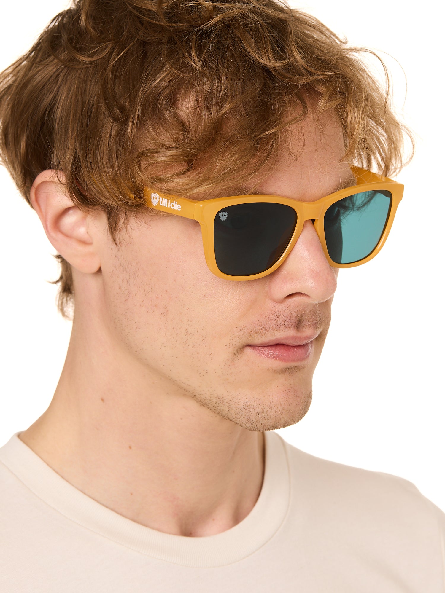 front view of a male model wearing the mango mermaid sunglasses on a white background