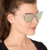 front view of a male model wearing the rosewater reflection sunglasses on a white background