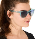 front view of a female model wearing the wave rider sunglasses on a white background