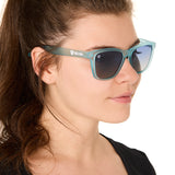front view of a female model wearing the wave rider sunglasses on a white background
