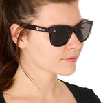 front view of a female model wearing the smoke and mirrors sunglasses on a white background