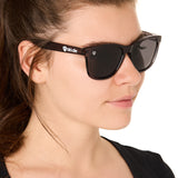 front view of a female model wearing the smoke and mirrors sunglasses on a white background