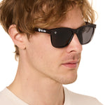 front view of a male model wearing the smoke and mirrors sunglasses on a white background