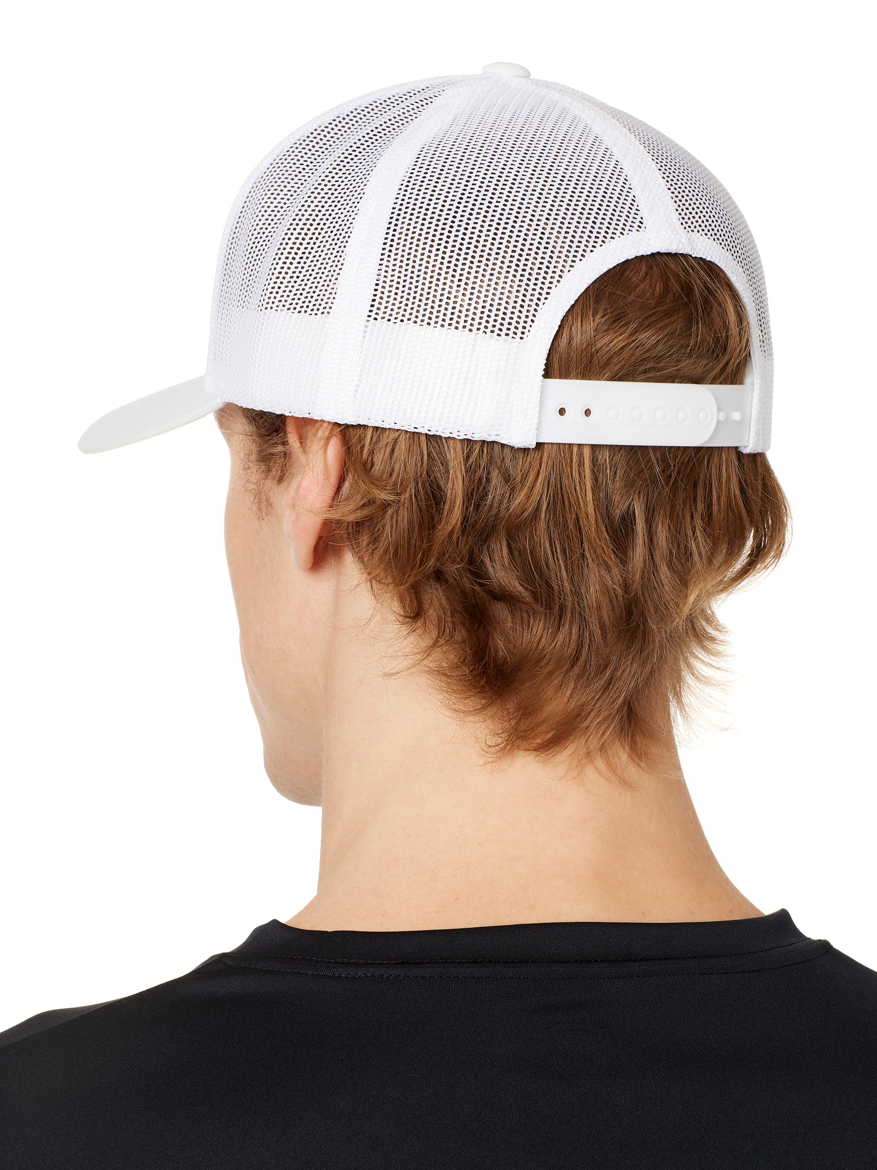 back view of a male model wearing a white classic trucker hat showing the mesh back panels and matching snapback closure