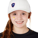 YOUTH WEARIG A WHITE TRUCKER HAT WITH NAVY AND RED DOUBLE DIAMOND LOGO ON A WHITE BACKGROUND
