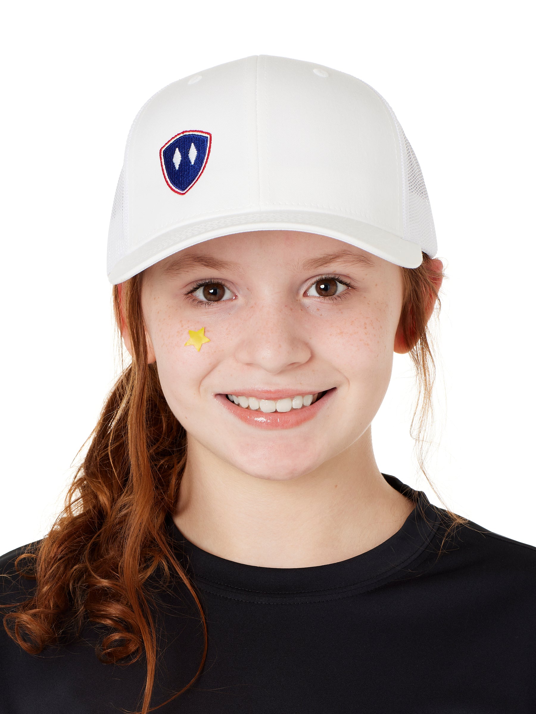 YOUTH WEARIG A WHITE TRUCKER HAT WITH NAVY AND RED DOUBLE DIAMOND LOGO ON A WHITE BACKGROUND