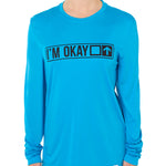 A female model wearing a blue long sleeve T-shirt with the text 'I'm Okay' IN A TRAIL SIGN DESIGN printed on the front.