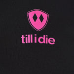 Detail of the hot pink till i die logo on a black performance long sleeve shirt