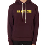 Front view of a male model wearing the "I'm Nasty" Oxblood Hoodie. The graphic features trail sign-inspired "I'm Nasty" text with a double diamond symbol indicating expert terrain.