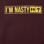 front detail of the 'I'm Nasty' hoodie in oxblood, the yellow design is in the style of a ski trail sign with the text "I'm Nasty" and two double diamonds