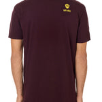 Back view of a male model wearing an oxblood tee shirt accented with a yellow till i die logo on wearers top right shoulder.