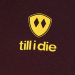 back detail of a an oxblood tee shirt with a yellow till i die logo
