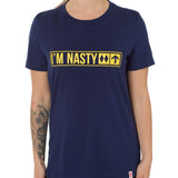 Front view of a female model wearing the "I'm Nasty" Navy Tee Shirt. The graphic features trail sign-inspired "I'm Nasty" text with a double diamond symbol indicating expert terrain.