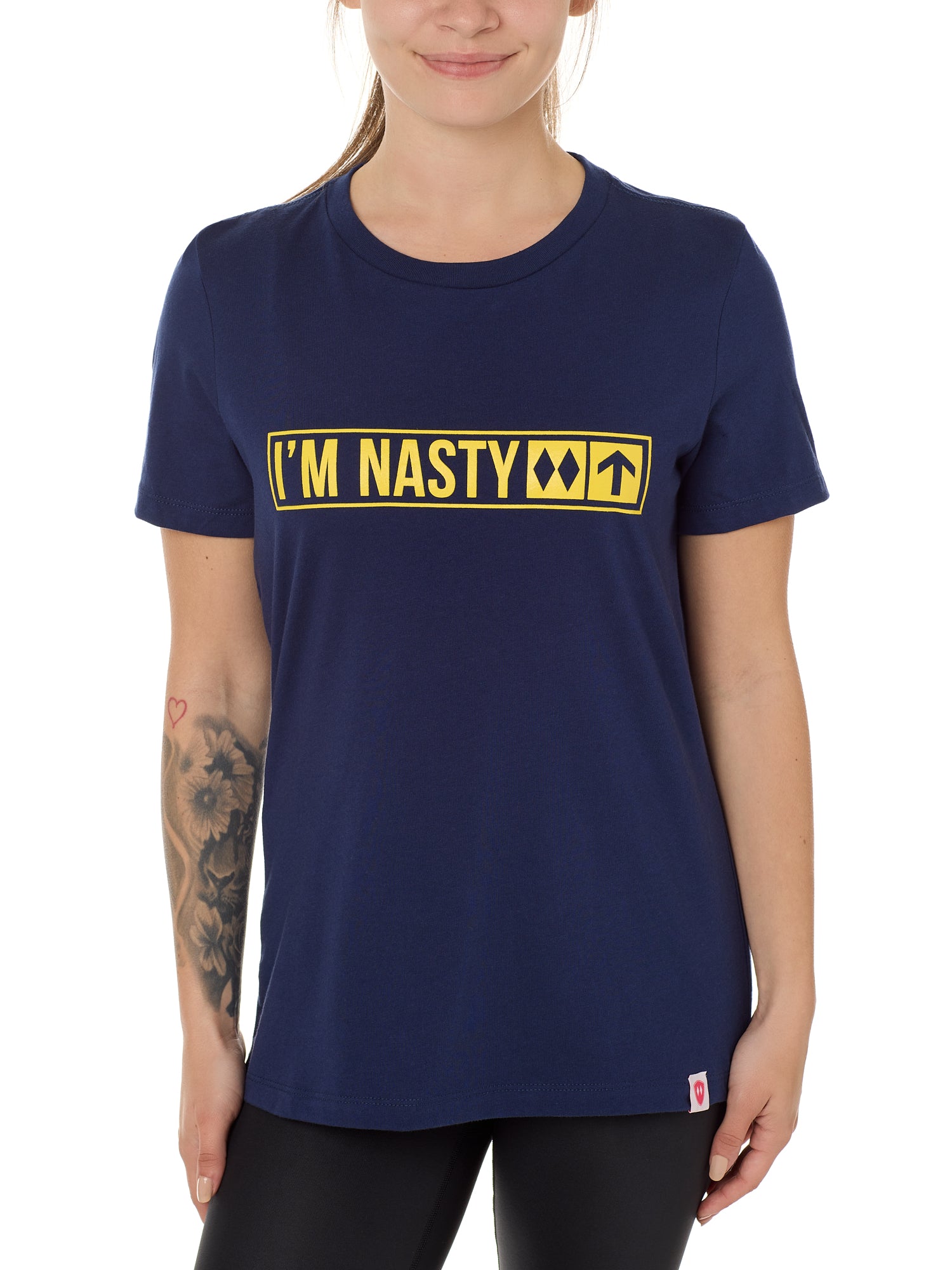Front view of a female model wearing the "I'm Nasty" Navy Tee Shirt. The graphic features trail sign-inspired "I'm Nasty" text with a double diamond symbol indicating expert terrain.