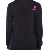 Back view of a female model wearing a black performance long sleeve shirt accented with a hot pink till i die logo on wearers top right shoulder.