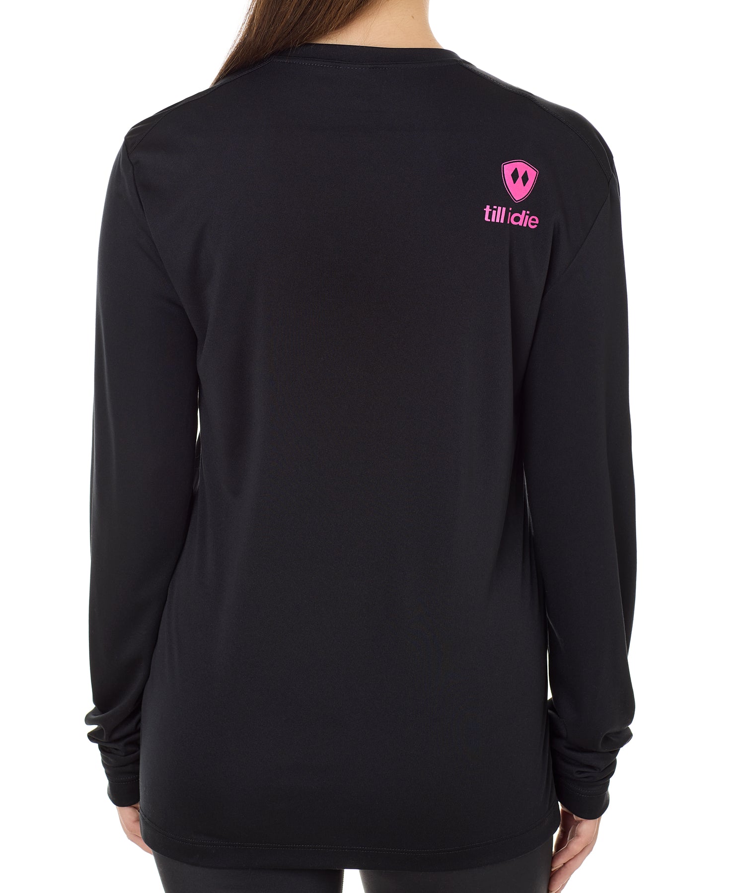 Back view of a female model wearing a black performance long sleeve shirt accented with a hot pink till i die logo on wearers top right shoulder.