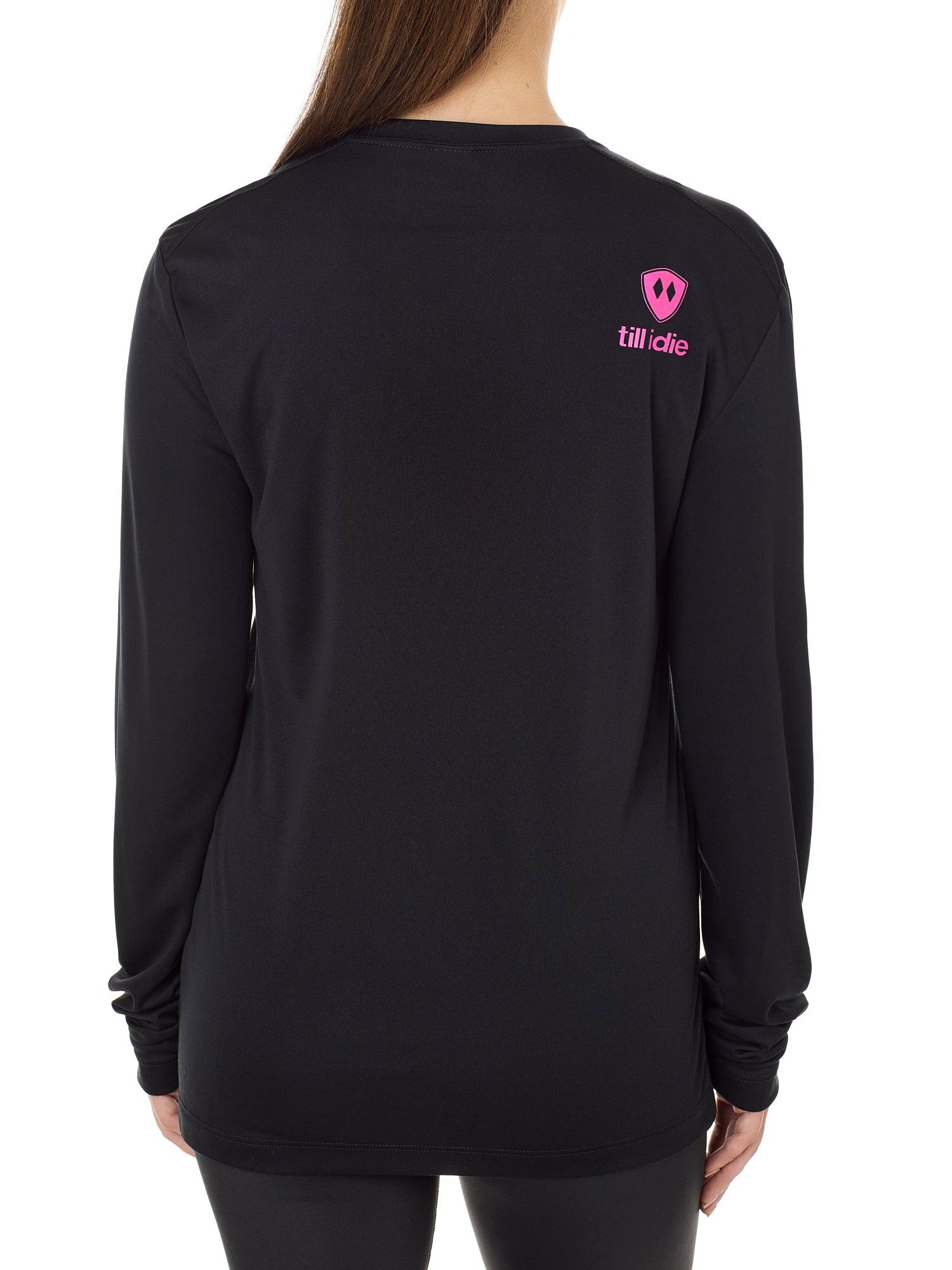 Back view of a female model wearing a black performance long sleeve shirt accented with a hot pink till i die logo on wearers top right shoulder.