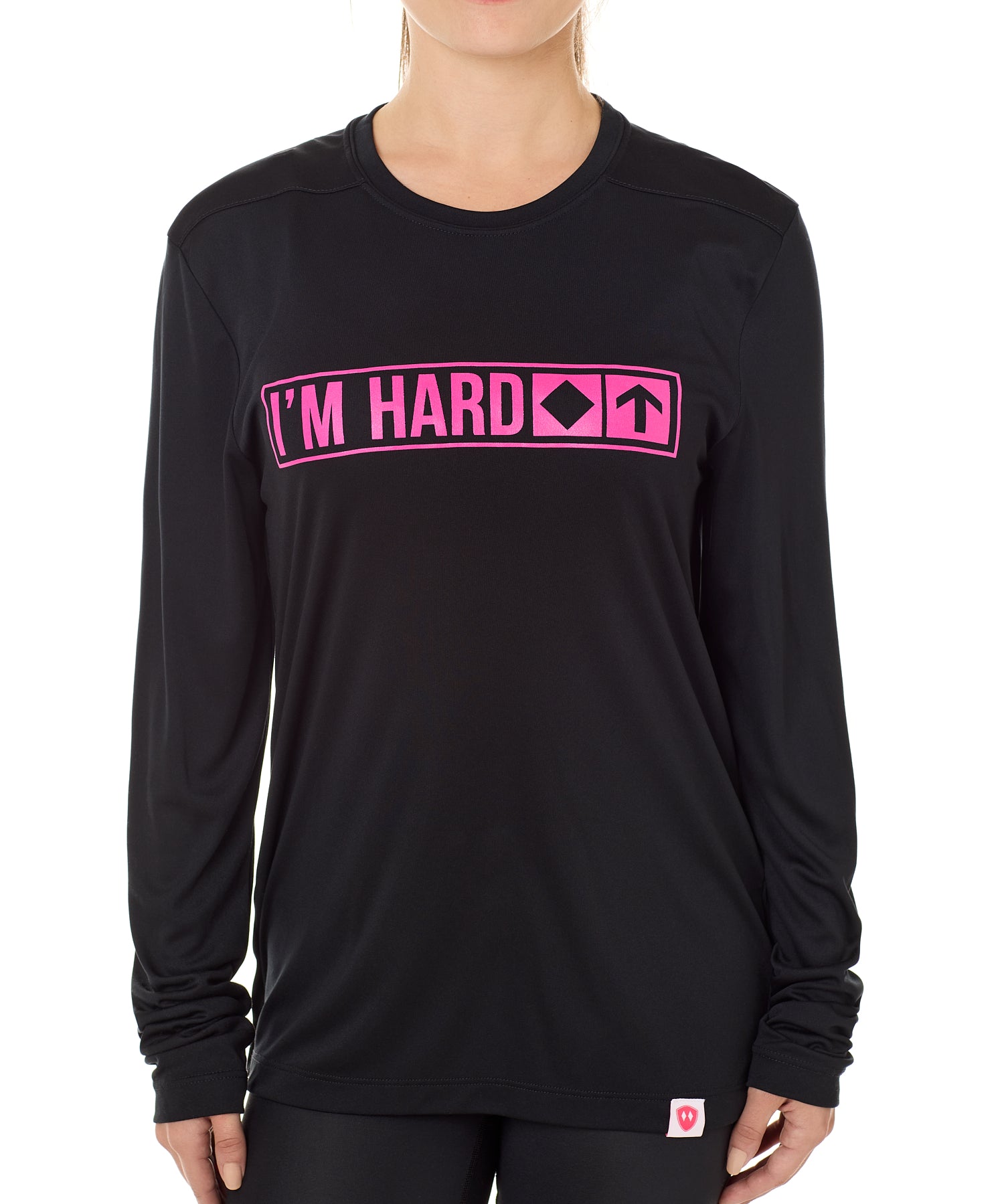 Front view of a female model wearing the "I'm Hard" Black performance long sleeve Shirt. The graphic features trail sign-inspired "I'm Hard" text with a single diamond symbol indicating advanced terrain.