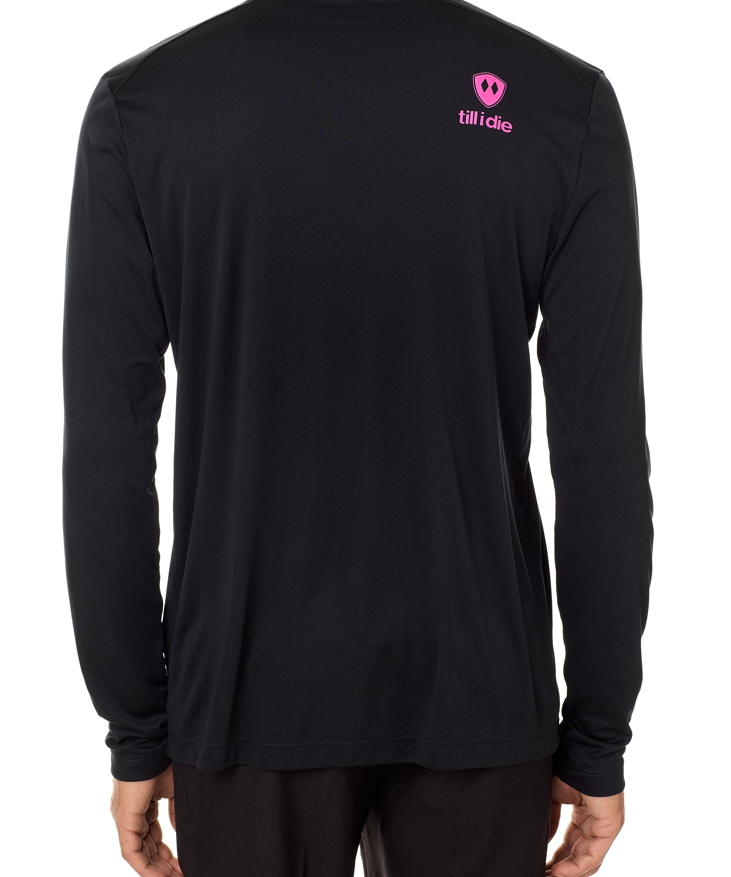 Back view of a male model wearing a black performance long sleeve shirt accented with a hot pink till i die logo on wearers top right shoulder.