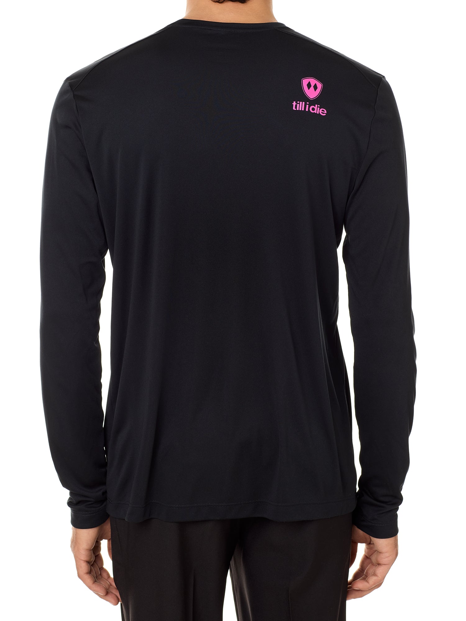 Back view of a male model wearing a black performance long sleeve shirt accented with a hot pink till i die logo on wearers top right shoulder.