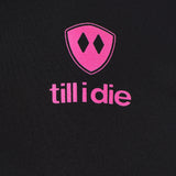 Detail of the hot pink till i die logo on a black performance long sleeve shirt