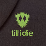 Detail of the lime green till i die logo on a Graphite Black Hoodie