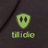Detail of the lime green till i die logo on a Graphite Black Hoodie