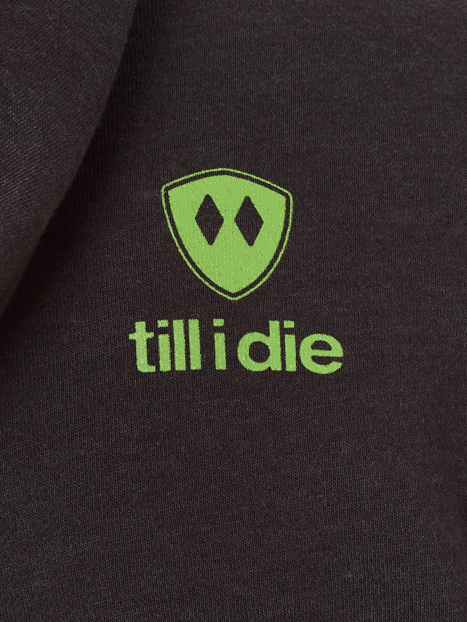 Detail of the lime green till i die logo on a Graphite Black Hoodie