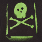 Detail of the Graffiti hoodie in Black, featuring a lime green spray painted style design of a skull and crossbones with overspray accents
