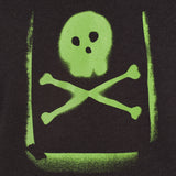 Detail of the Graffiti hoodie in Black, featuring a lime green spray painted style design of a skull and crossbones with overspray accents