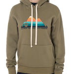 A woman wearing a green hoodie with a mountain and sunset design and the text 'DO WHAT YOU LOVE. DO IT FOREVER.' on it.