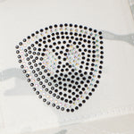 Close Up detail of a Rhinestone Embellished double diamond shield on an alpine white camouflage base