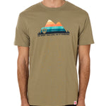 A male model wearing a green crew neck t-shirt with a mountain and sunset design and 'DO WHAT YOU LOVE. DO IT FORVER.' TEXT