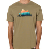 A male model wearing a green crew neck t-shirt with a mountain and sunset design and 'DO WHAT YOU LOVE. DO IT FORVER.' TEXT