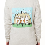 FEMALE MODEL WEARING A HEATHER OATMEAL HOODIE WITH HOOD UP, FEATURING A GRAPHIC OF A CARTOON MOUNTAIN THAT HAS TILL I DIE ACROSS IT