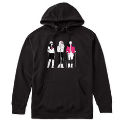 Black hoodie featuring an illustrated trio of female skiers dressed in retro 1980s ski fashion, rendered in black and white with bold hot pink accents.