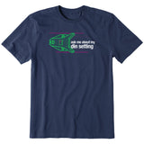 Navy short sleeve T-shirt featuring a neon green technical illustration of a ski binding with hot pink accents and a DIN setting cranked to 11, alongside bold white text reading, “Ask me about my DIN setting.”