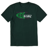 Dark green short sleeve T-shirt featuring a neon green technical illustration of a ski binding with hot pink accents and a DIN setting cranked to 11, alongside bold white text reading, “Ask me about my DIN setting.”
