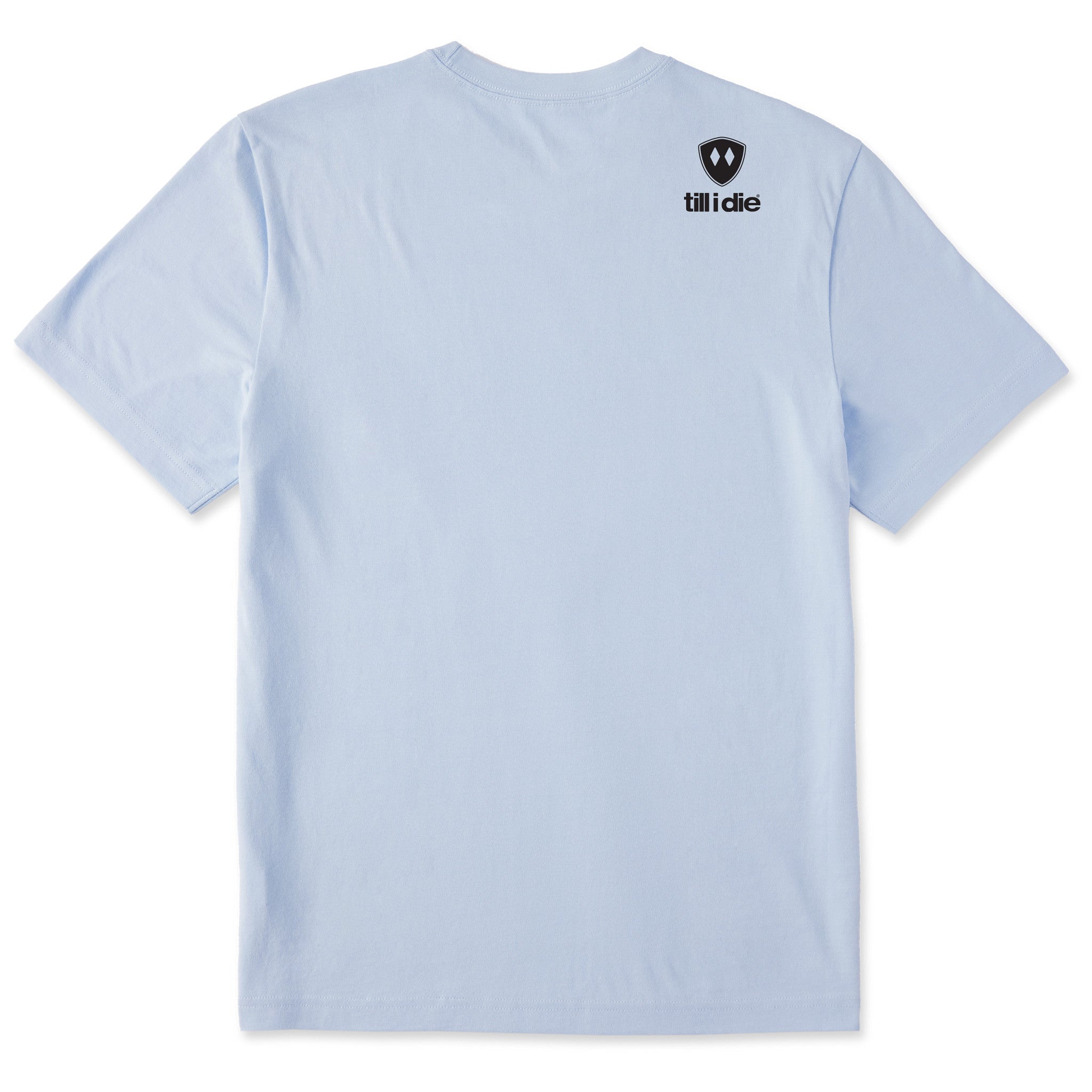 A light blue tee shirt shown from the back, featuring the double diamond shield logo and the text 'till i die' on the upper right shoulder, set against a plain white background.